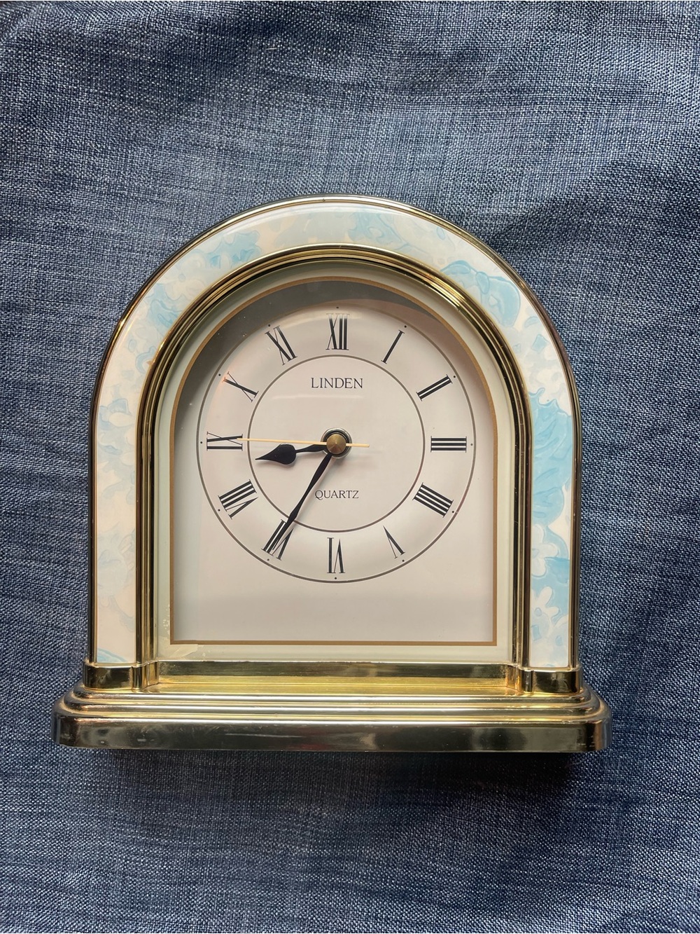 Vintage Linden Quartz Gold-Trimmed Arch Clock with Light Blue Accents